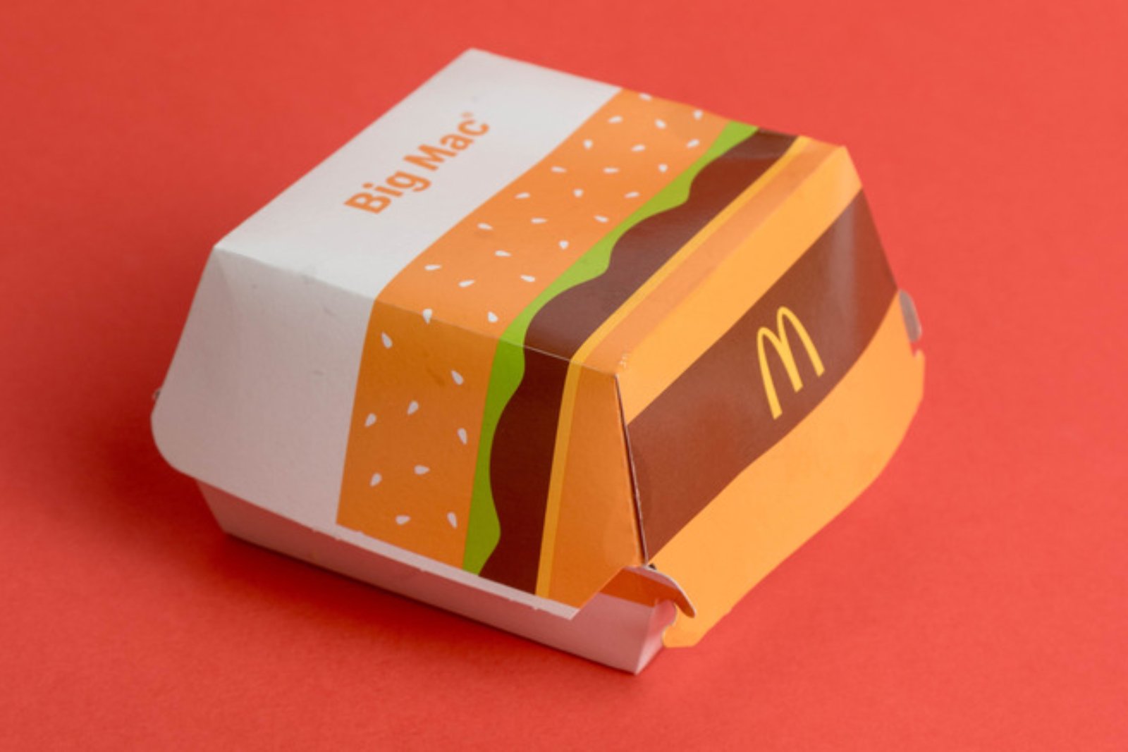 A McDonald's Big Mac box on a red background