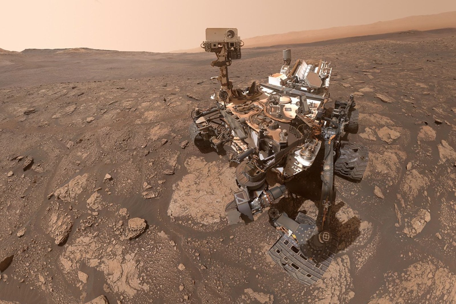 Illustration for: How many 1.8 oz (51 g) Mars bars would it take to weigh as much as NASA's Curiosity rover?